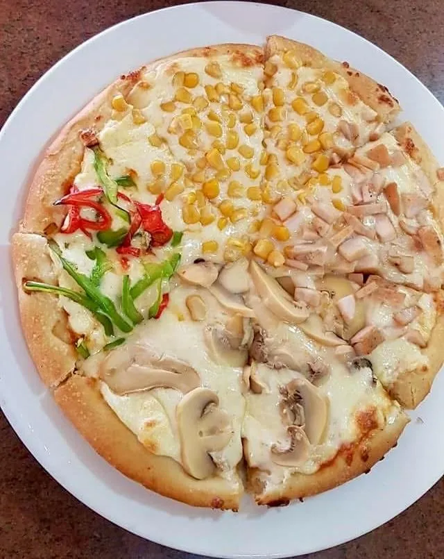 بيتزا  الفصول الأربعة